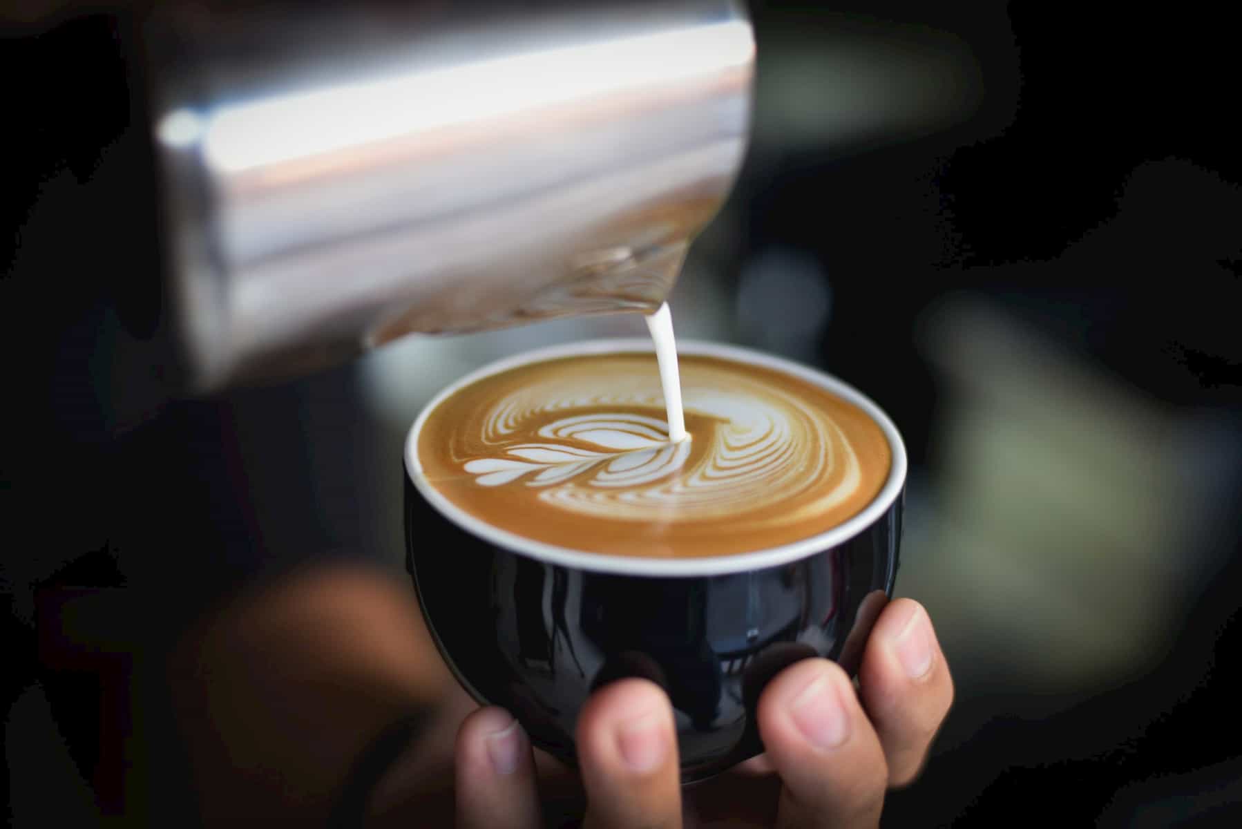 Milk being poured into an espresso